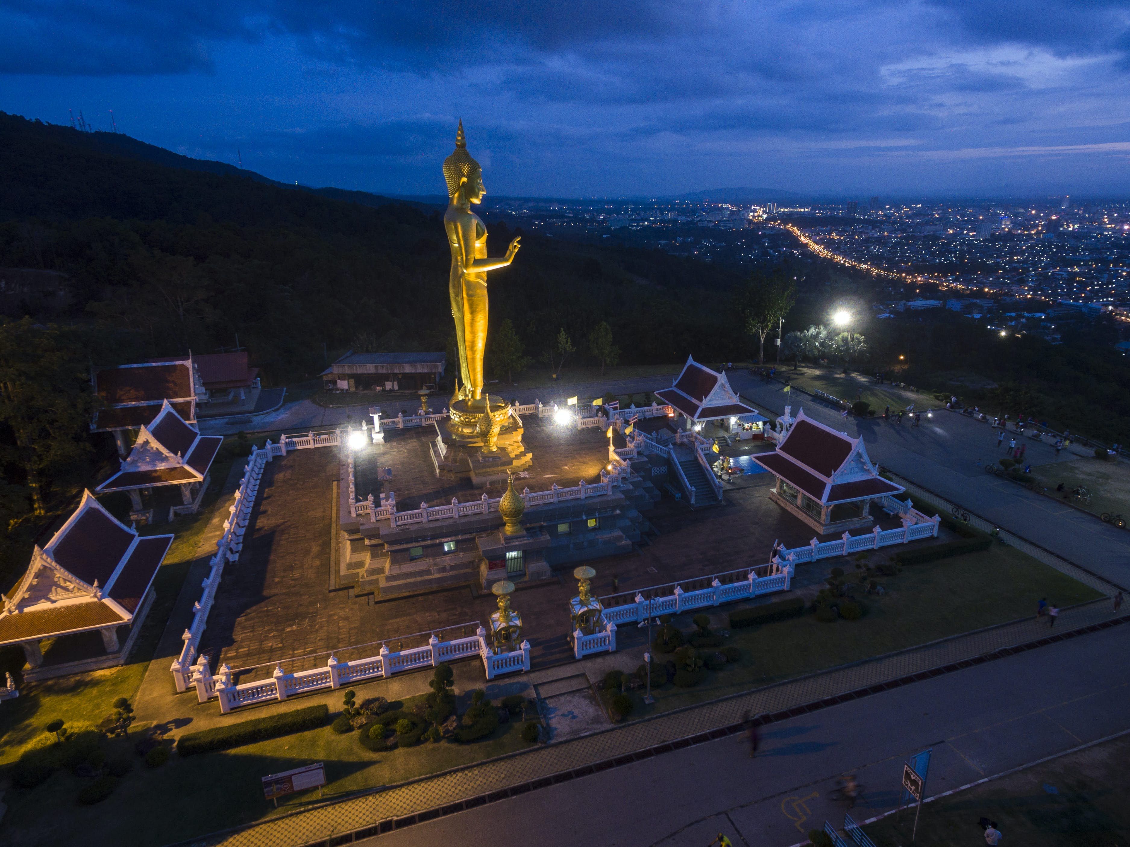 A standing Buddha on a hill overlooks the city of Songkhla © Bento Fotography / Getty Images