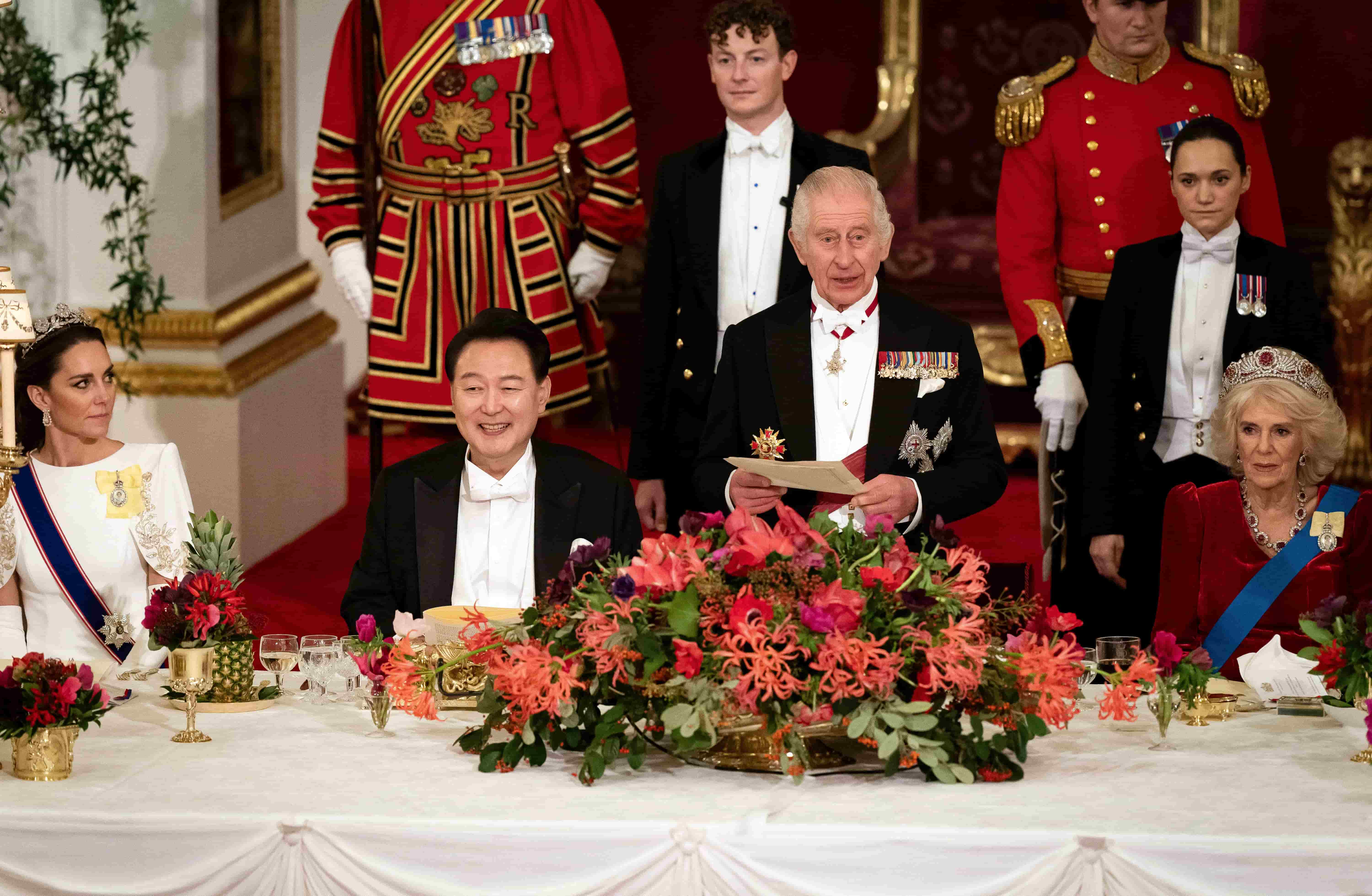 3 of 4 | President of South Korea Yoon Suk Yeol listens as King Charles III speaks at the state banquet at Buckingham Palace, London, Tuesday, Nov. 21, 2023 for the state visit to the UK by President of South Korea Yoon Suk Yeol and his wife Kim Keon Hee. (Aaron Chown/Pool Photo via AP)