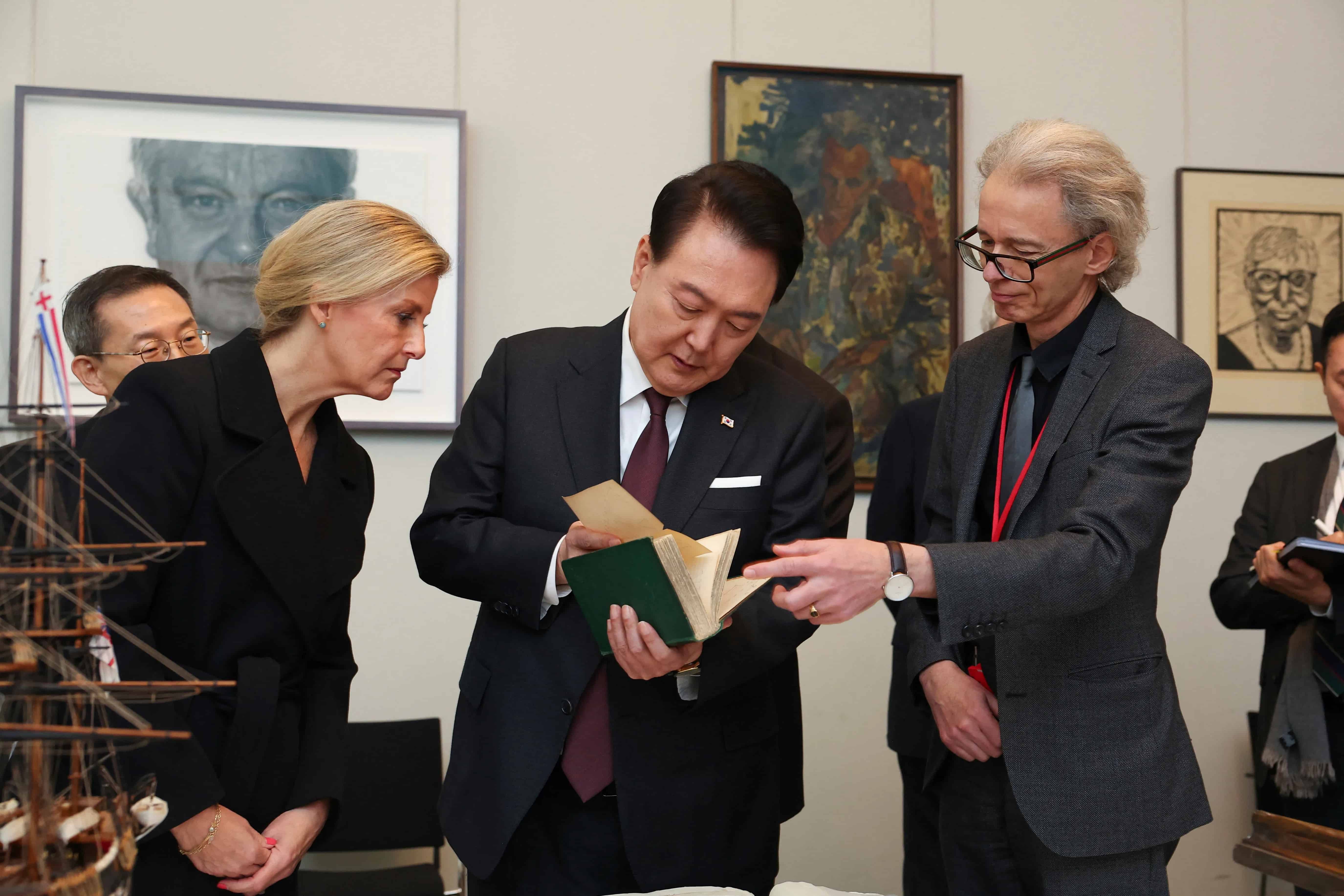 4 of 4 | Head of Library at The Royal Society, Keith Moore, right, shows the first edition of Charles Darwins book Of the origin of species to South Koreas President Yoon Suk Yeol, center, and Britains Sophie, the Duchess of Edinburgh, on the occasion of Yeols visit to the Royal Society, in London, Wednesday, Nov. 22, 2023. Yeol is on a three-day state visit to Britain. (Toby Melville/Pool Photo via AP)